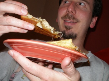 Bryce enjoying the finished pizza